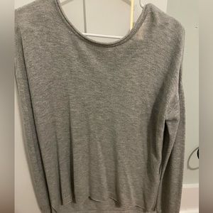 Grey sweater with a zipper in the back